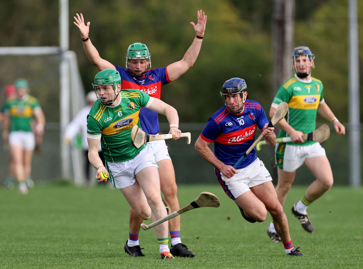  Barry Óg Murphy and Maurice O' Carroll, Erin's Own, trying to stop the run of Cormac O'Brien, Newtownshandrum, at Mourneabbey. Picture: Jim Coughlan.
