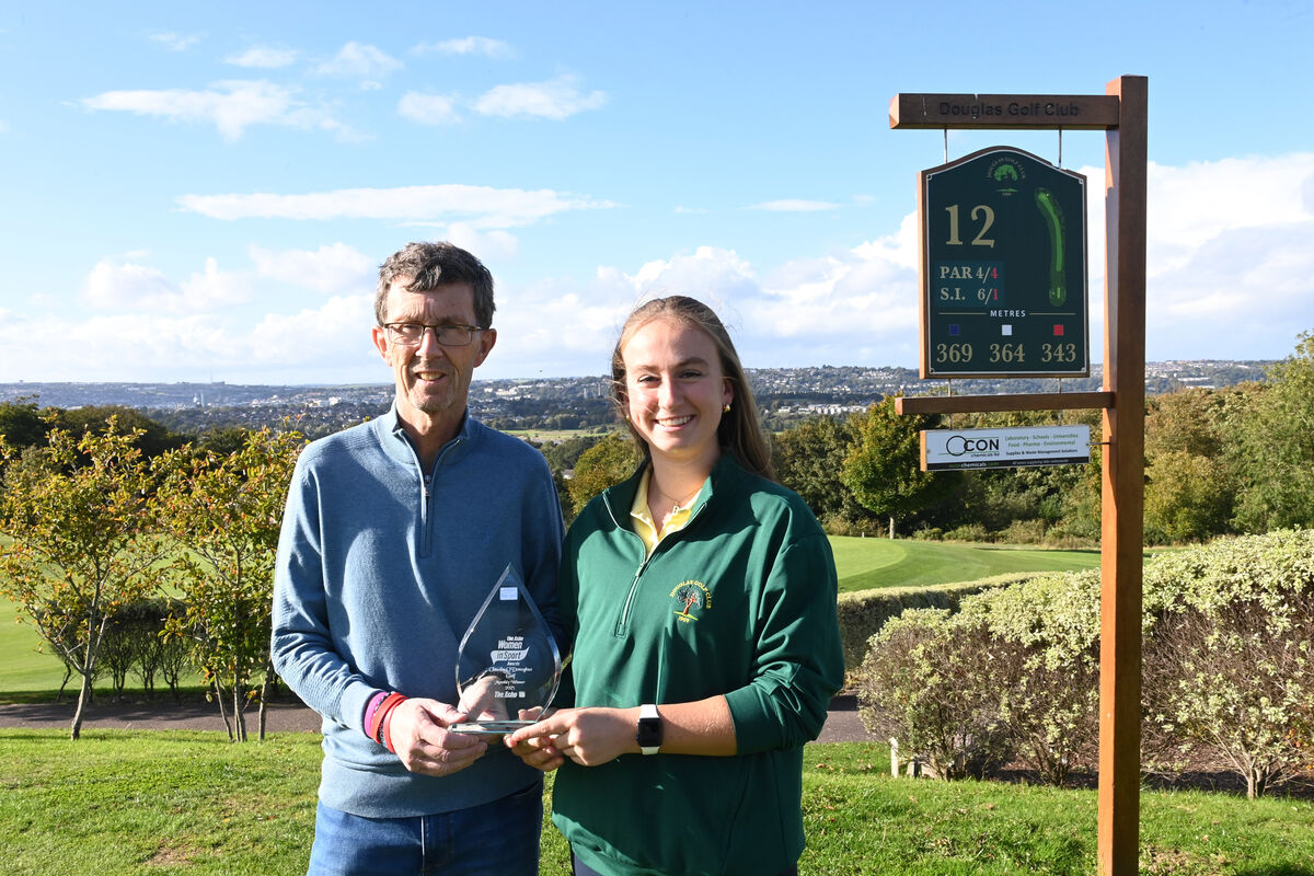 Golfer Claudia O'Donoghue of Douglas Golf Club, Cork is congratulated by Rory Noonan, The Echo at the presentation of the Women in Sport Monthly Award. Picture: Larry Cummins