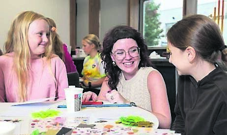 Artist Ava Hayes (Sample Studios) guiding Penny Lane (aged 11, Glanmire) and Hannah O’Sullivan (aged 10, Carrigtwohill) during the Make Your Own Greeting Cards workshop on Culture night at MTU Bishopstown Campus.	Picture: Joleen Cronin
                    