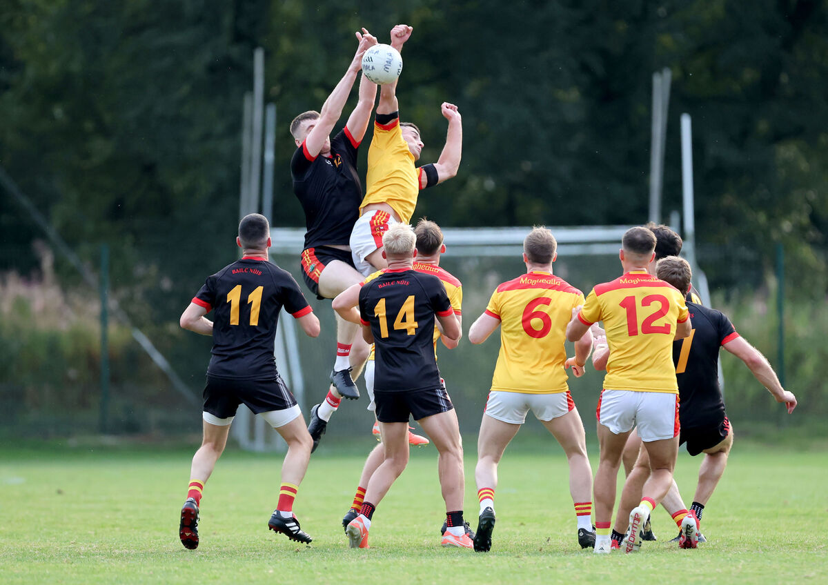  David Buckley of Newcestown and Shane Merritt of Mallow battle for the high ball. Picture: Jim Coughlan