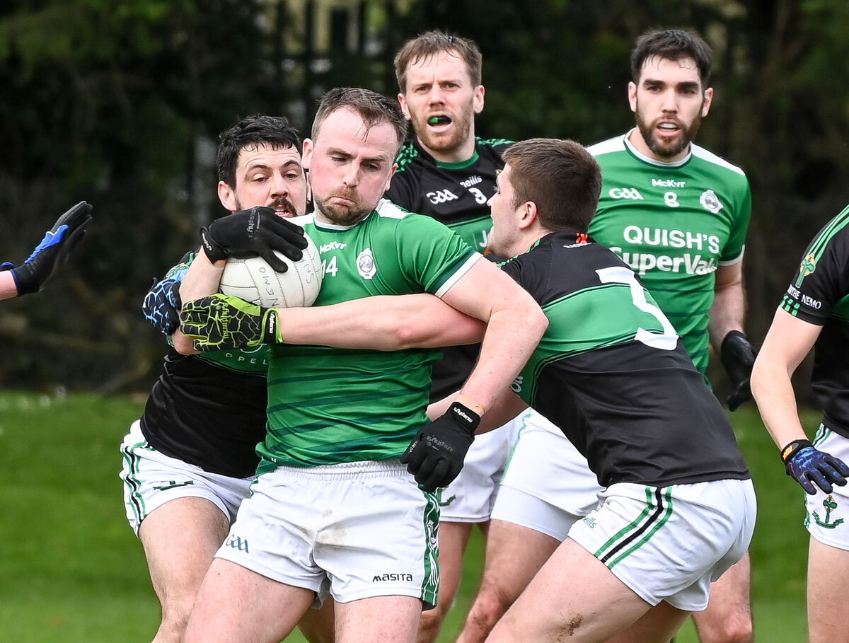  Ballincollig's Cian Dorgan is tackled by Nemo Rangers' Kevin Fulignati and Mark Hill last season. Picture: David Keane