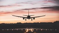 Aircraft landing at sunrise