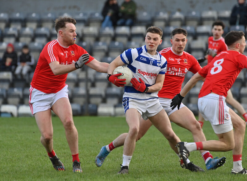  Ballygarvan players Piaras O'Halloran, Seán Brady and Stephen Fenton surround Shay Dineen, Inniscarra in their McCarthy Insurance Group Junior A Football Championship match at Páirc Uí Rinn. Picture: Dan Linehan