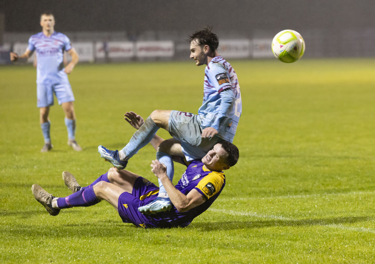 Wexford's James Crawford collides with Cobh Ramblers' John O'Donovan. Picture: Patrick Browne