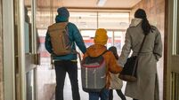 Happy family on train station