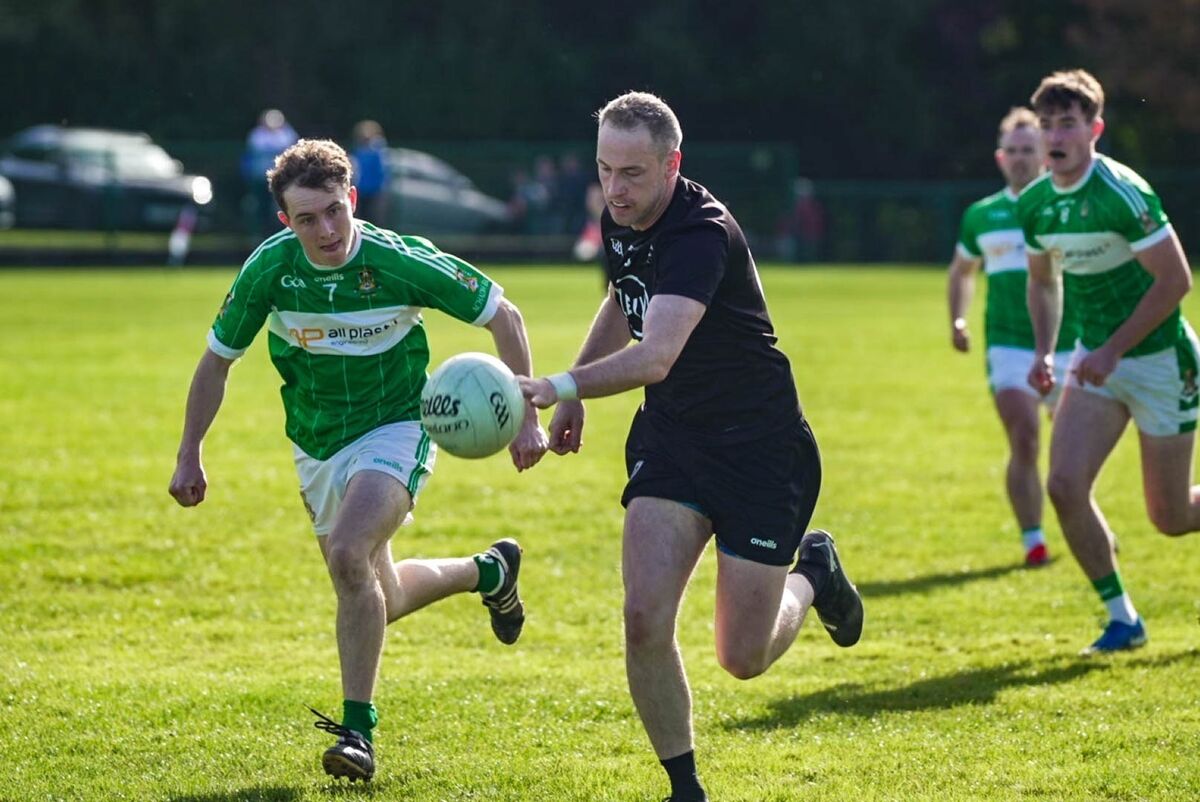 Kiskeam's Gene Casey ltakes on Brendan O’Sullivan of Aghabullogue Picture: Noel Sweeney