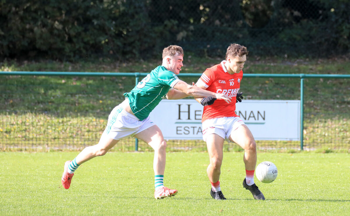 Dromtarriffe's Evan Murphy clears from Vincent's Luke Callnan. Picture: David Creedon