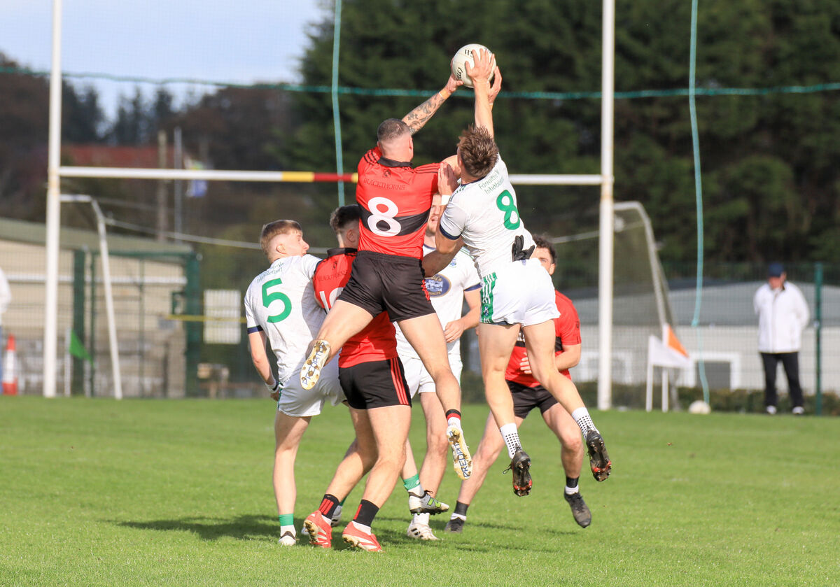 Mitchelstown's Sean Walsh and Ilen Rovers' Dermot Hegarty rise together for the ball. Picture: David Creedon