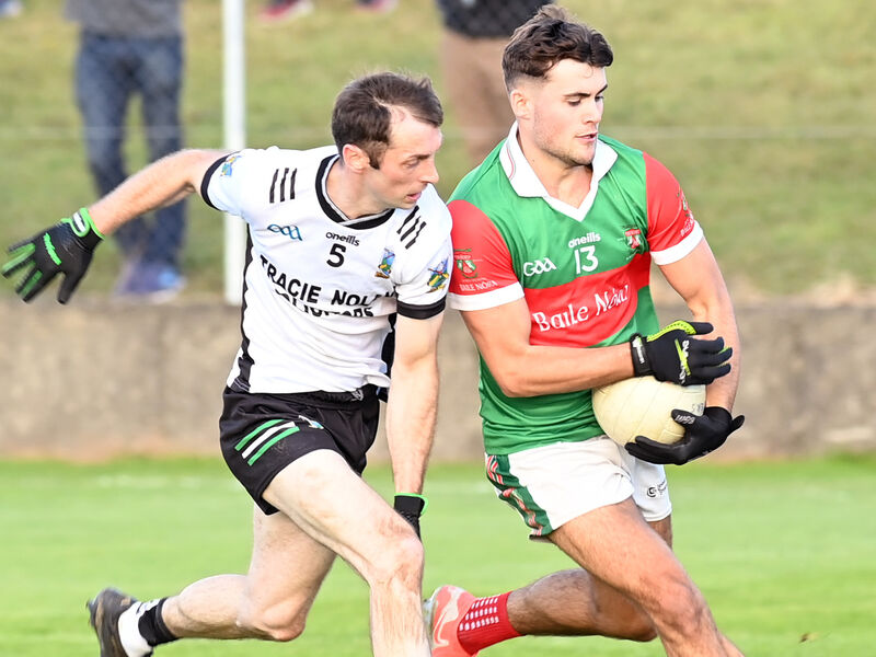 Mark Cronin (Ballinora) gets away from Ger O'Callaghan (Gabriel Rangers) at Rossmore. Picture: Martin Walsh.