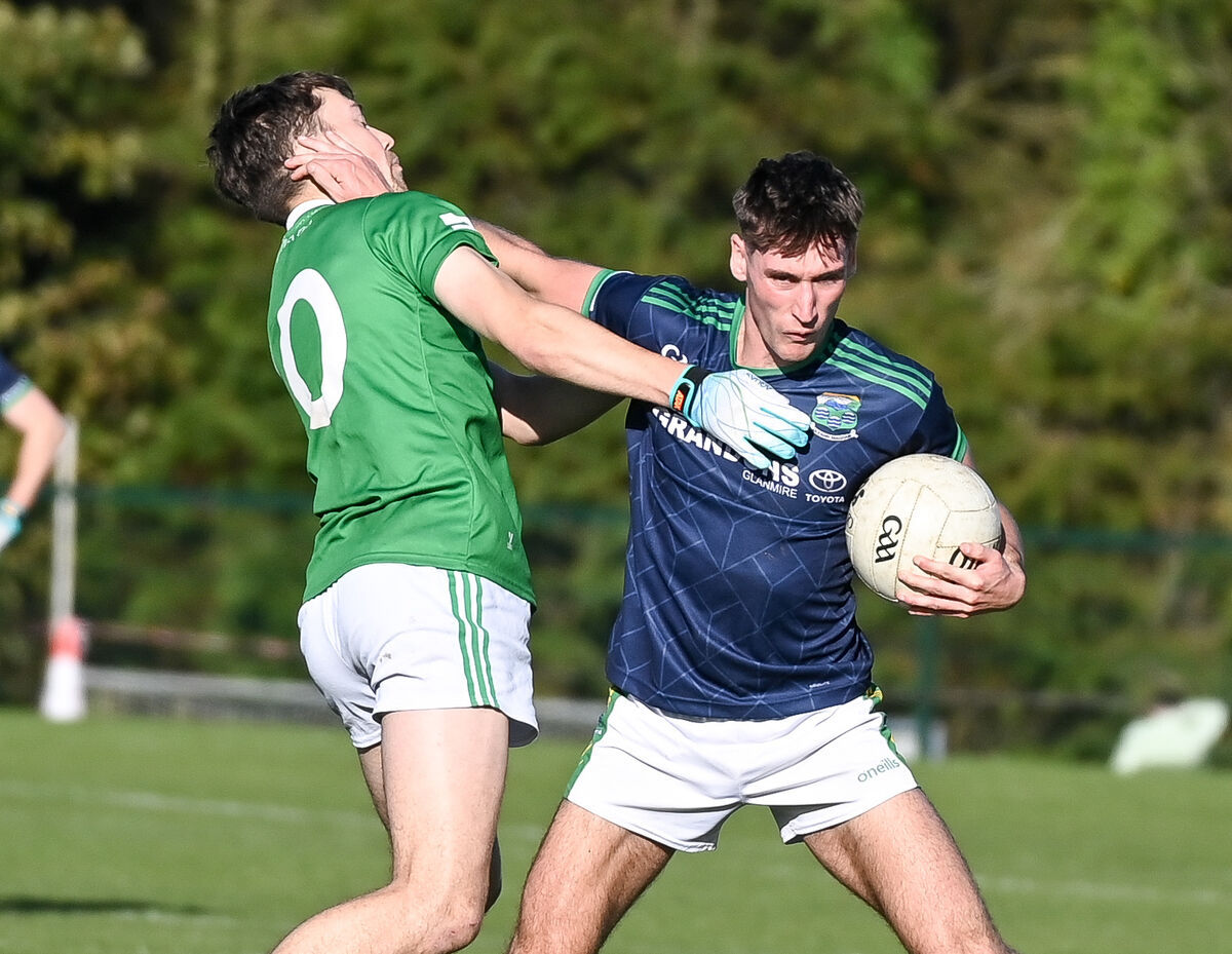  Glanmire's Darragh Murray fends off the challenge of Aghada's Diarmuid Byrne. Picture: David Keane.