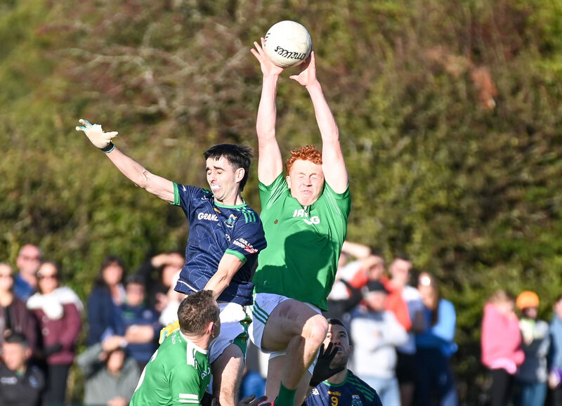  Aghada's Diarmuid Phelan goes high to win possession from Glanmire's Luke Hackett. Picture: David Keane.