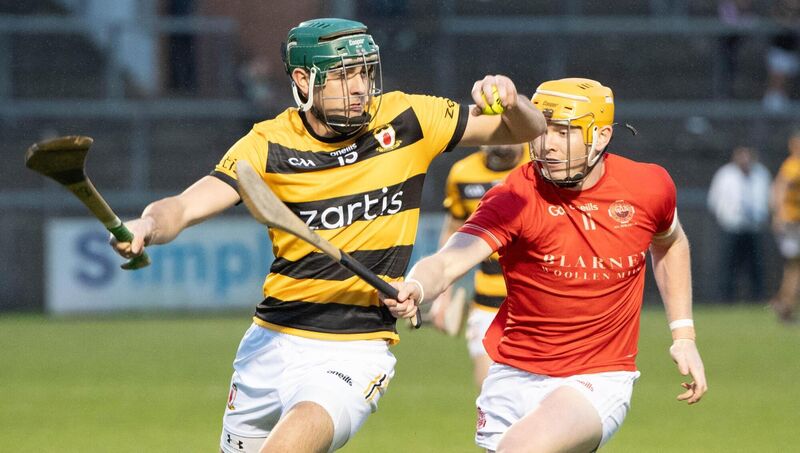  Luke Sheehan of Na Piarsaigh holds onto possession while being challenged by Blarney's Shane Barrett during their SAHC quarter final in Pairc Ui Rinn. Picture: Howard Crowdy