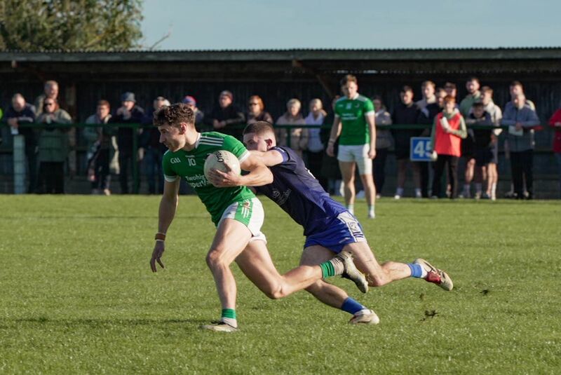 Michael Mahoney of Knocknagree tries to halt the progress of Kanturk's Paul Walsh. Picture: Noel Sweeney