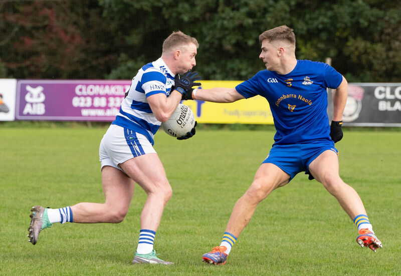 Castlehaven's Brian Hurley about to be blocked by Dylan Quinn of St Finbar's during the County Premier Senior Football Championship quarter final match in Clonakilty. Picture: Howard Crowdy