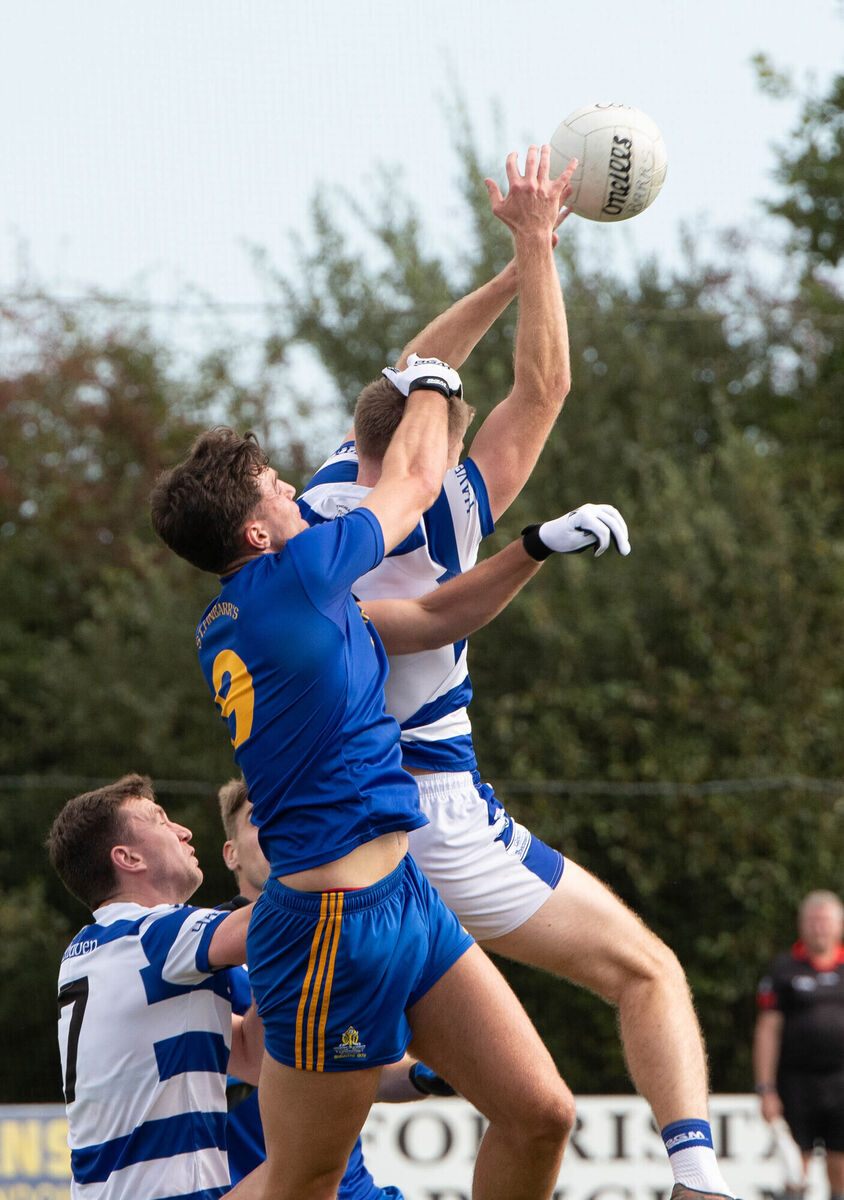 Castlehaven's Andrew Whelton gathers a high ball ahead of St Finbarr's Brian Hayes during the County Premier Senior Football Championship quarter final match in Clonakilty. Picture: Howard Crowdy