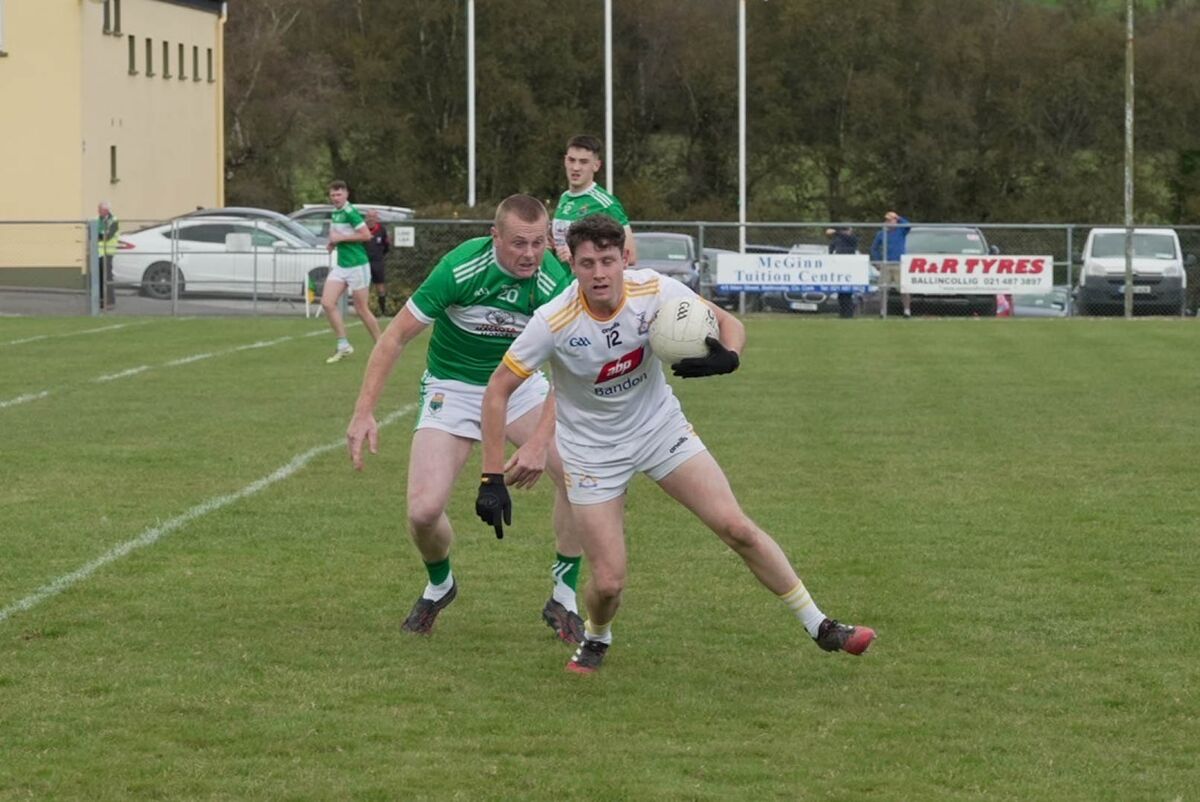 Bandon's Cathal Lynch battling Macroom's Pa Lucey. Picture: Noel Sweeney