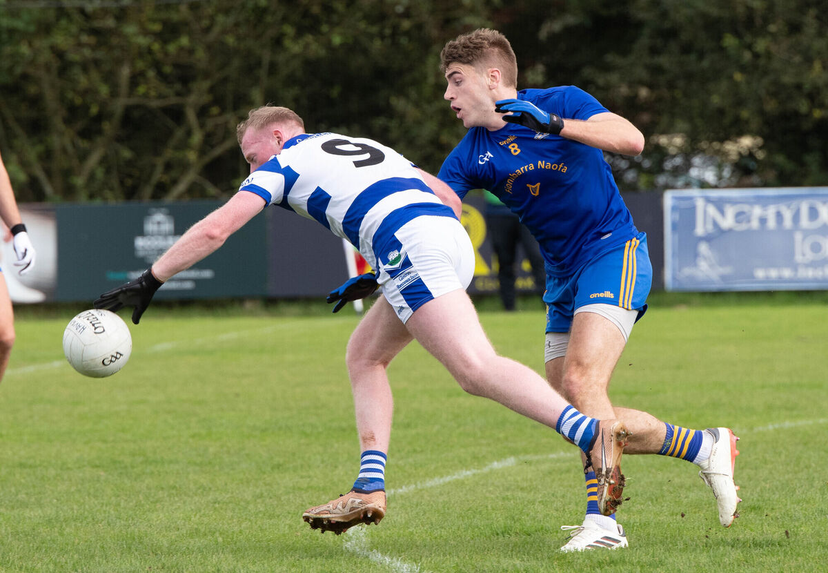 Castlehaven's Conor Cahalane reaches out for the ball despite the challenge from St Finbarr's Ian Maguire. Picture: Howard Crowdy