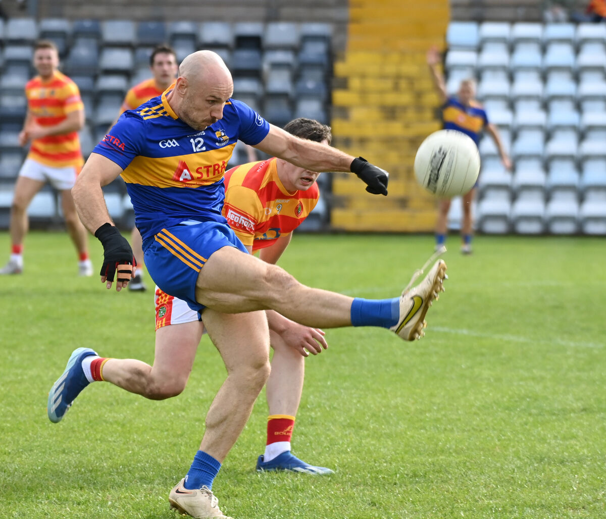 Carrigaline's Brian O'Driscoll shoots from Newcestown's Eoghan Collins. Picture: Eddie O'Hare