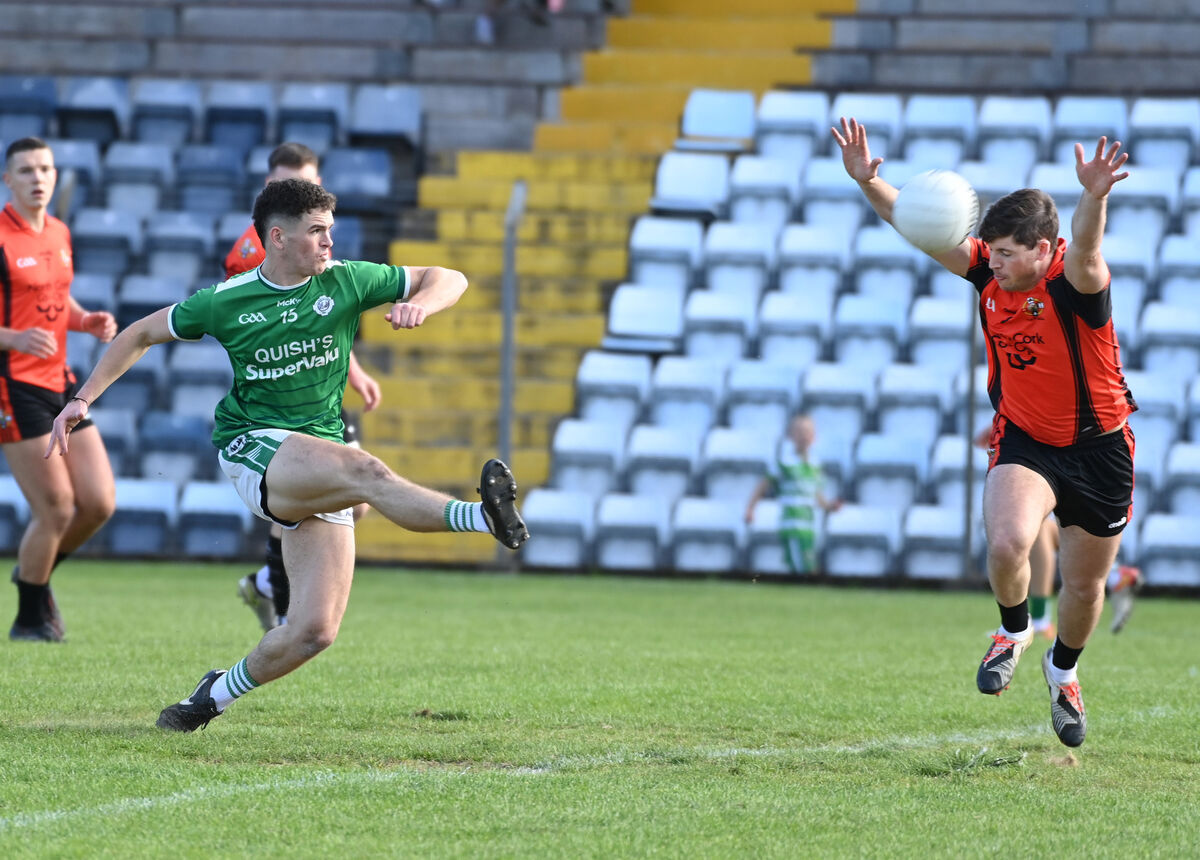 Darragh O'Mahony gets a shot in as Duhallow's Kevin Crowley closes in. Picture: Eddie O'Hare Darragh O'Mahony gets a shot in as Duhallow's Kevin Crowley closes in. Picture: Eddie O'Hare