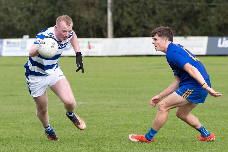 Castlehaven's Conor Cahalane keeps the ball away from John Wiggington-Barrett of St Finbarr's. Picture: Howard Crowdy