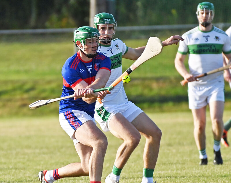 Erin's Own's Robbie O'Flynn shoots from Kanturk's Tommy Walsh last year. Picture: Eddie O'Hare Erin's Own's Robbie O'Flynn shoots from Kanturk's Tommy Walsh last year. Picture: Eddie O'Hare