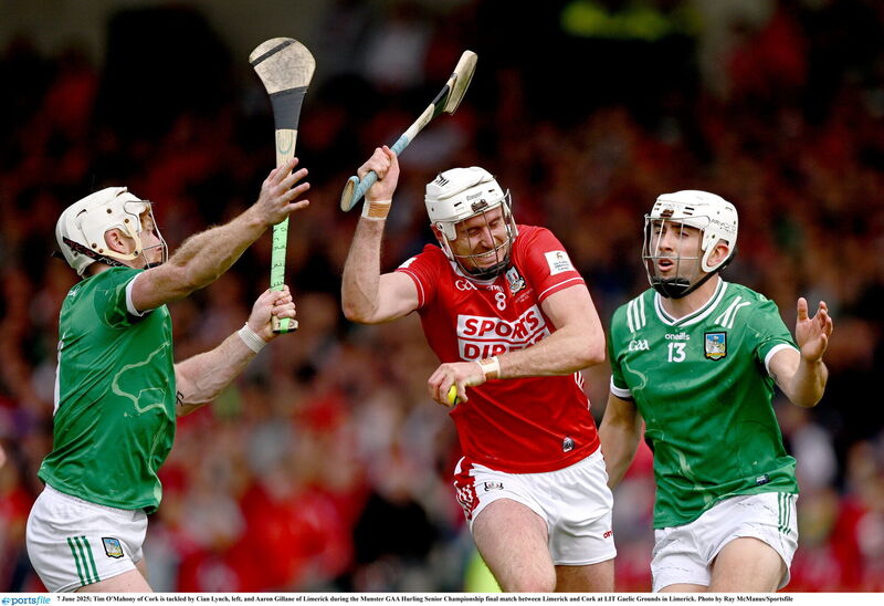 Tim O'Mahony of Cork is tackled by Cian Lynch, left, and Aaron Gillane of Limerick in the Munster final. Picture: Ray McManus/Sportsfile