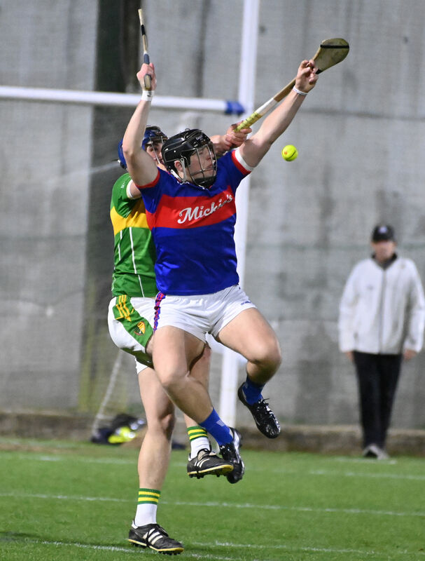 Erin's Own's Finn O'Brien goes high with Newtownshandrum's Kieran O'Sullivan. Picture: Eddie O'Hare