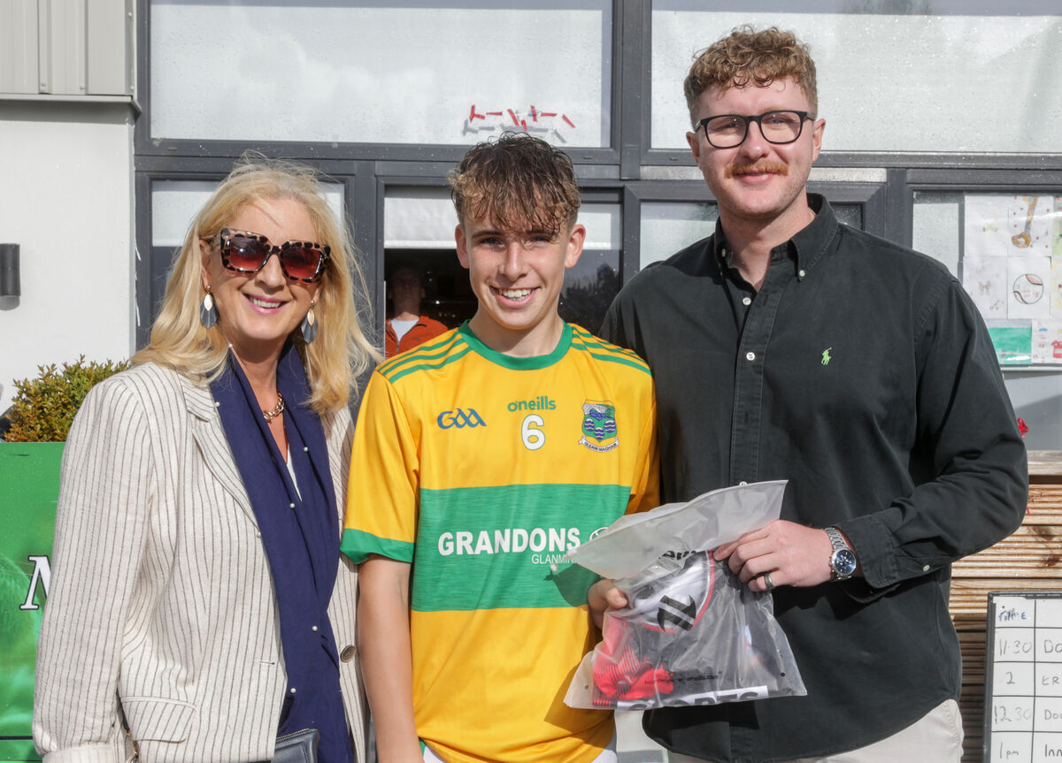 Pauline and Brian Flahive present the Best Player Award in the cup to Rory Davis of Glanmire.  Picture: David Creedon