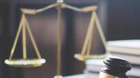 Scales of justice and Gavel on wooden table and Lawyer or Judge working with agreement in Courtroom, Justice and Law concept