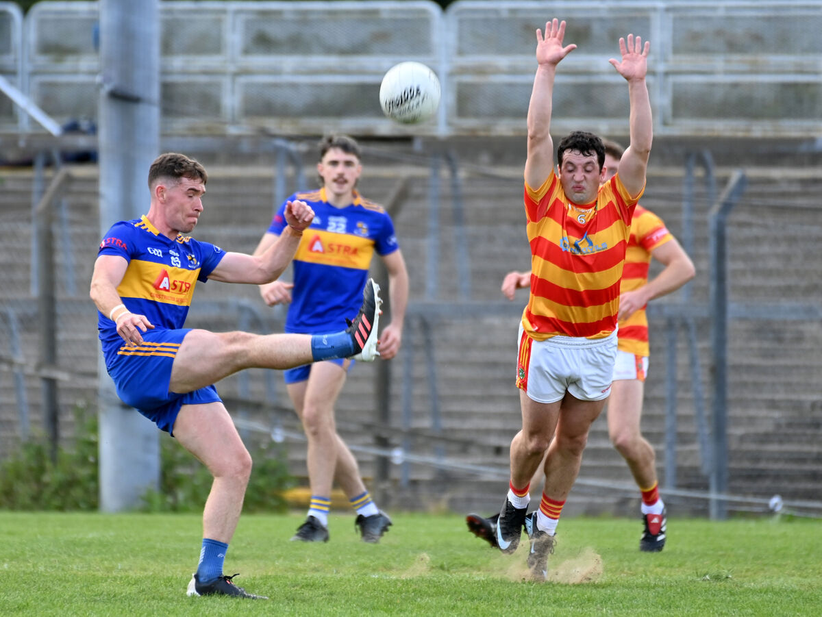 Carrigaline's Eanna Desmond shoots from Newcestown's Michael McSweeney. Picture: Eddie O'Hare