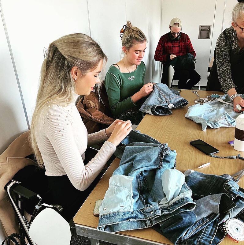 Participants at a denim upcycling workshop organised by FASH Forward.