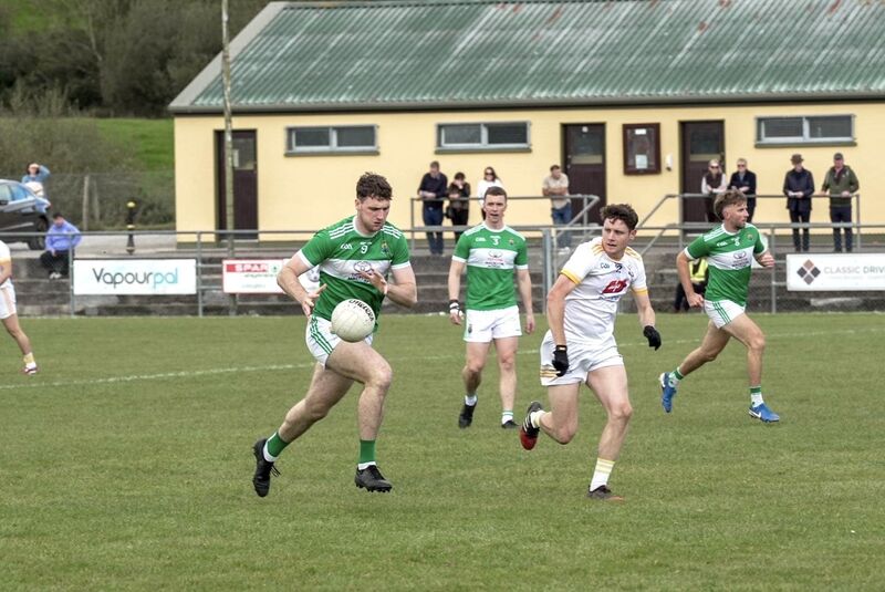 Macroom’s Cillian O'Donovan soloing past Bandon’s Cathal Lynch. Picture: Noel Sweeney