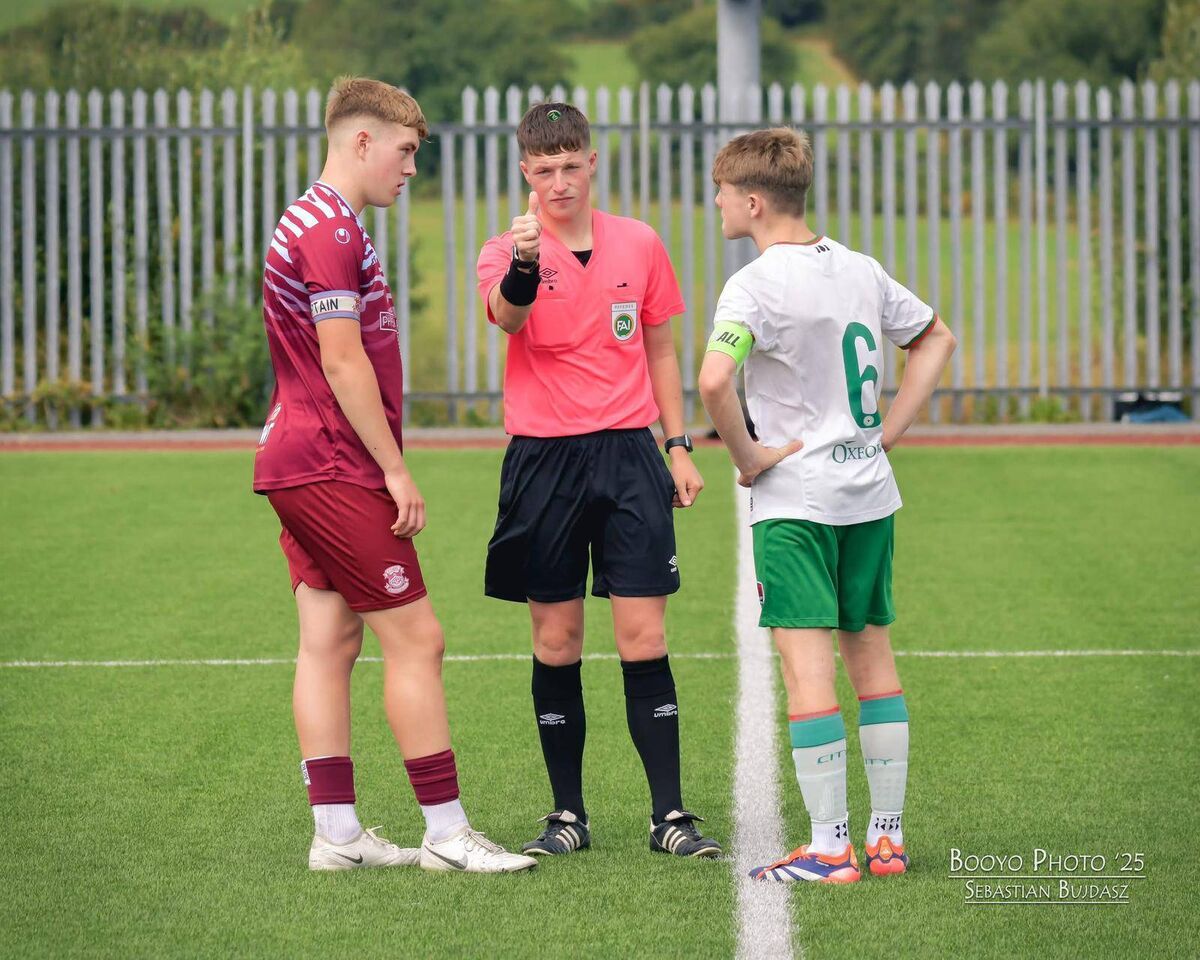Referee Bobby Coonan talking to the captains from Cork City and Cobh Ramblers before their U17 League of Ireland game in Bishopstown.