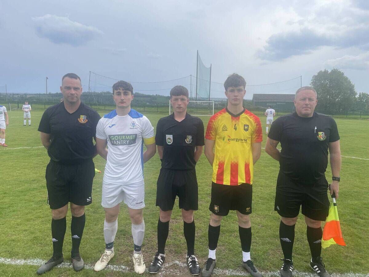 Assistant referee Jason Creamer, Kinsale captain George Feeney, referee Bobby Coonan, Mogeely captain Louie Fitzgerald and assistant referee David Hickey before an U19 League 1A playoff game at Ringmahon Park.