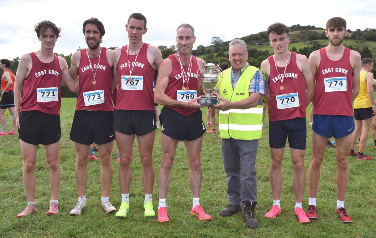 Bill Allen, Chairperson of Cork Athletics, presenting the Donal Barrett Perpetual Cup to Michael Harty of the wining East Cork team. Also included are team members John Spelman, Nicky O'Donoghue, Paul Hartnett, Frank O'Brien and Ciarán McNamee. Missing from the picture is Brian Harty. Picture: John Walshe 