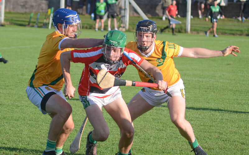 Ballincollig's Seán O'Neill manages to evade the challenge from Dungourney's James McCarthy and Niall Motherway in 2023. Picture: Howard Crowdy