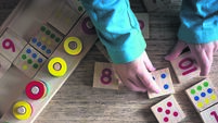 Child playing with mathematical toy