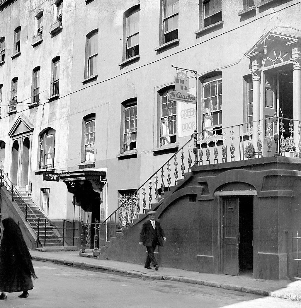 The Green Door café near the old Echo and Examiner offices at Academy Street, Cork, in 1935. The Chateau pub below is still going strong