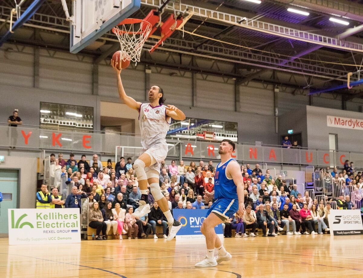 Neptune's Nil Sabata leaps to score against UCC Demons. Picture: David Creedon
