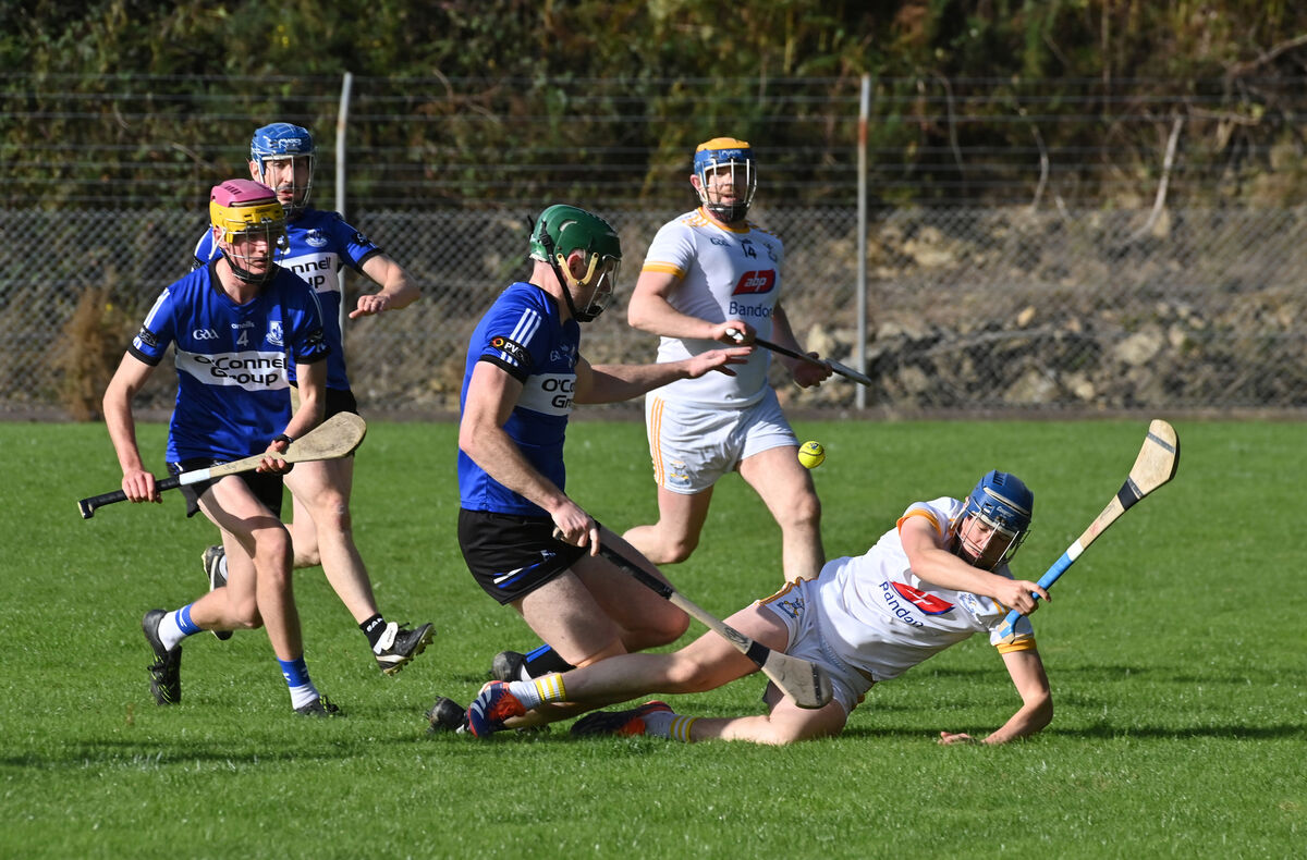  Eolann McSweeney, Bandon, takes a tumble in this clash with Sarsfields' Kevin Crowley. Picture: Dan Linehan