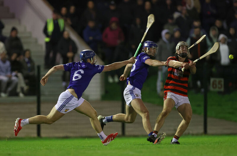  Darragh O'Sullivan and Simon O'Neill of Ballinhassig put the pressure on Éanna Motherway of Cloyne. Picture: Jim Coughlan