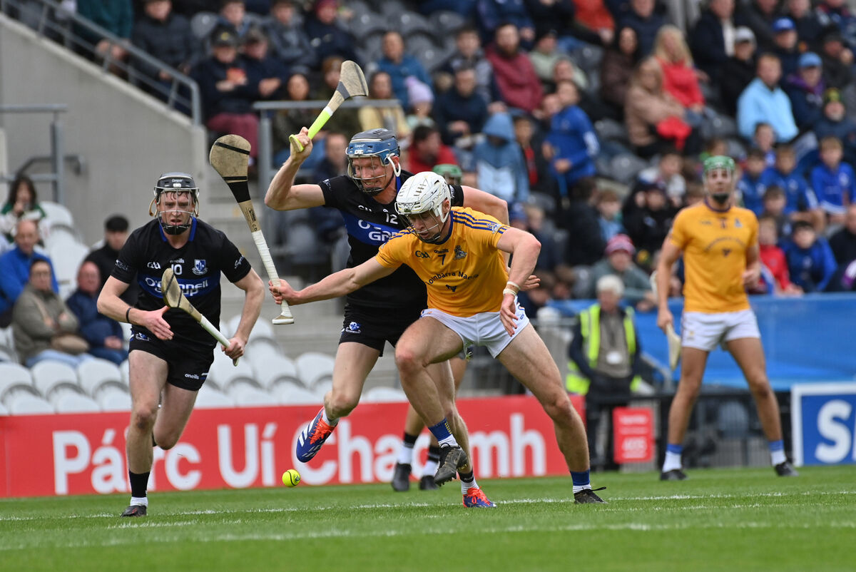  Cian Darcy of Sarsfields getting in a tackle on Ciarán Doolan of St Finbarr's. Picture: Dan Linehan