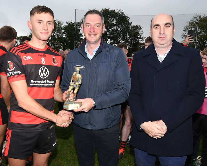 Hugh O'Connor (Newmarket) receives the Duhallow JAHC Man of the Match from Connie Tarrant in the presence of Steven Lynch, chairman, Duhallow Junior Board. Picture: John Tarrant 