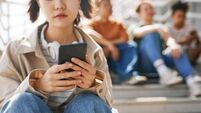 Teen Girl Waiting for Text Message