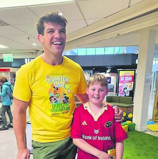 Donncha O’Callaghan with Zack Lenihan at the launch of ‘Disaster Day Fun Day Fiasco’ at Easons Douglas, the latest children’s book by Mr O’Callaghan.