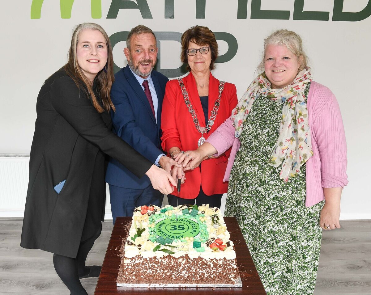 Cutting the cake at the 35th anniversary celebrations of Mayfield Community Development Programme.