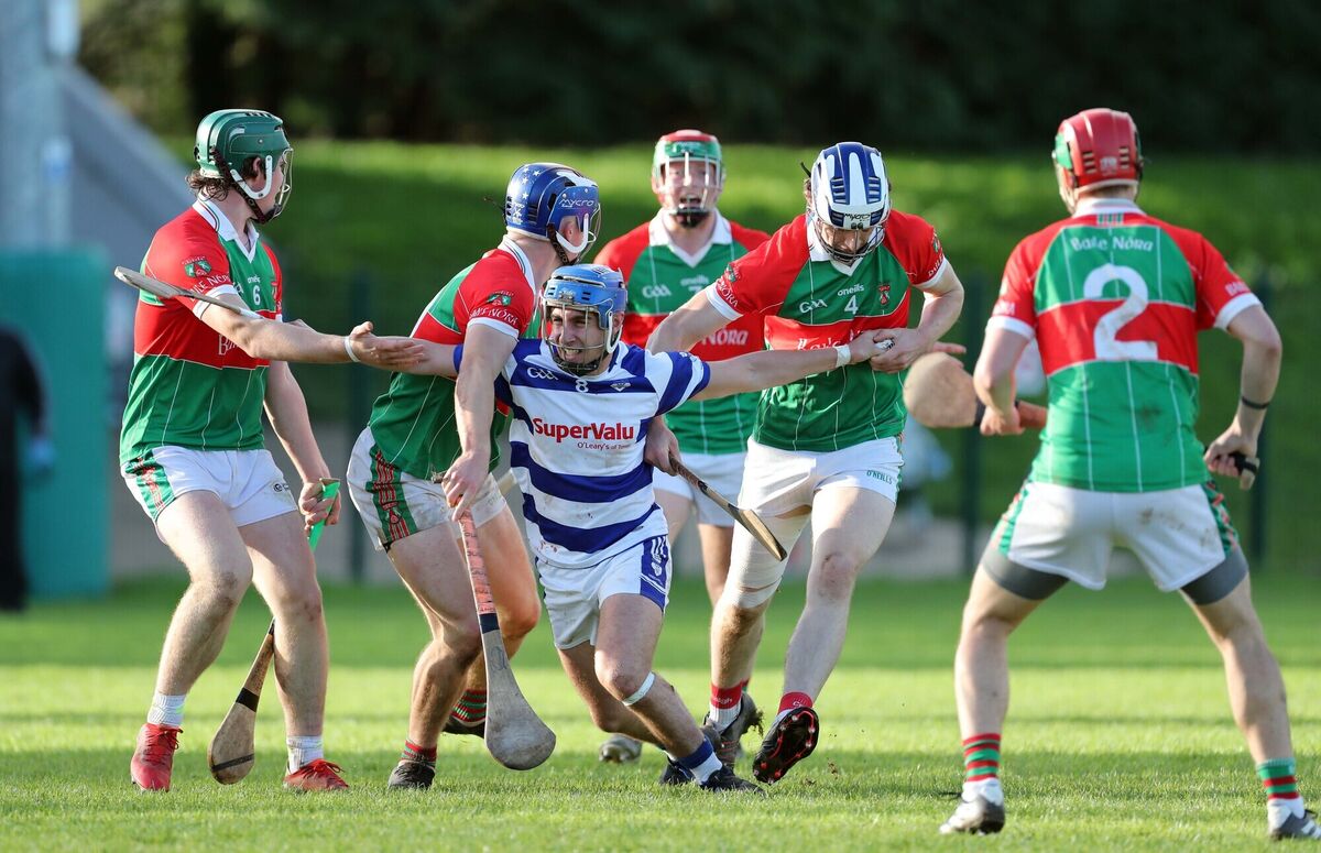 James Lordan (second from right, blue and white helmet) in action for Ballinora hurlers along with Shane Kingston, Neil Lordan and Kevin O'Regan against Liam Buckley of Inniscarra in the 2021 Muskerry JAHC final. Picture: Jim Coughlan