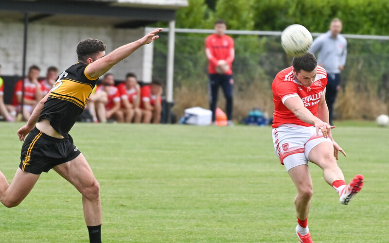  Iveleary's Cathal Vaughan scores a two-pointer as Clyda Rovers' Gary Deane closes in, during their Division 3 Football League final at Donoughmore. Picture: David Keane.