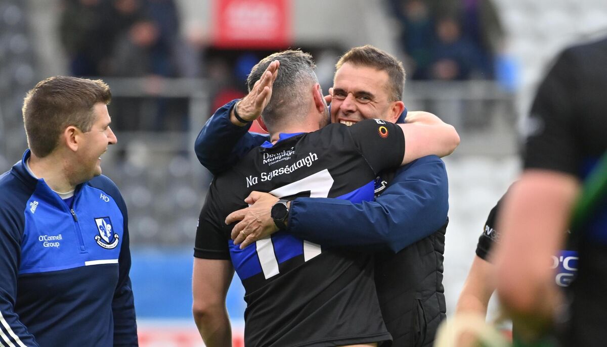 Sarsfields manager Johnny Crowley with Eoghan Murphy after Sunday's game. Picture: Dan Linehan