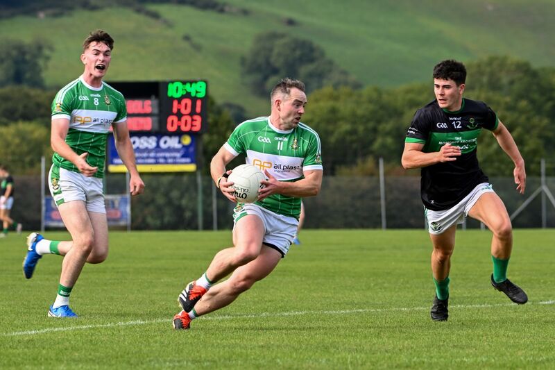 Aghabullogue captain John Corkery breaks forward chased by Nemo Rangers' Oisín Whyte. Picture: Chani Anderson Aghabullogue captain John Corkery breaks forward chased by Nemo Rangers' Oisín Whyte. Picture: Chani Anderson